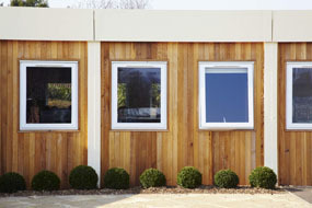 Recycled modular building clad in timber